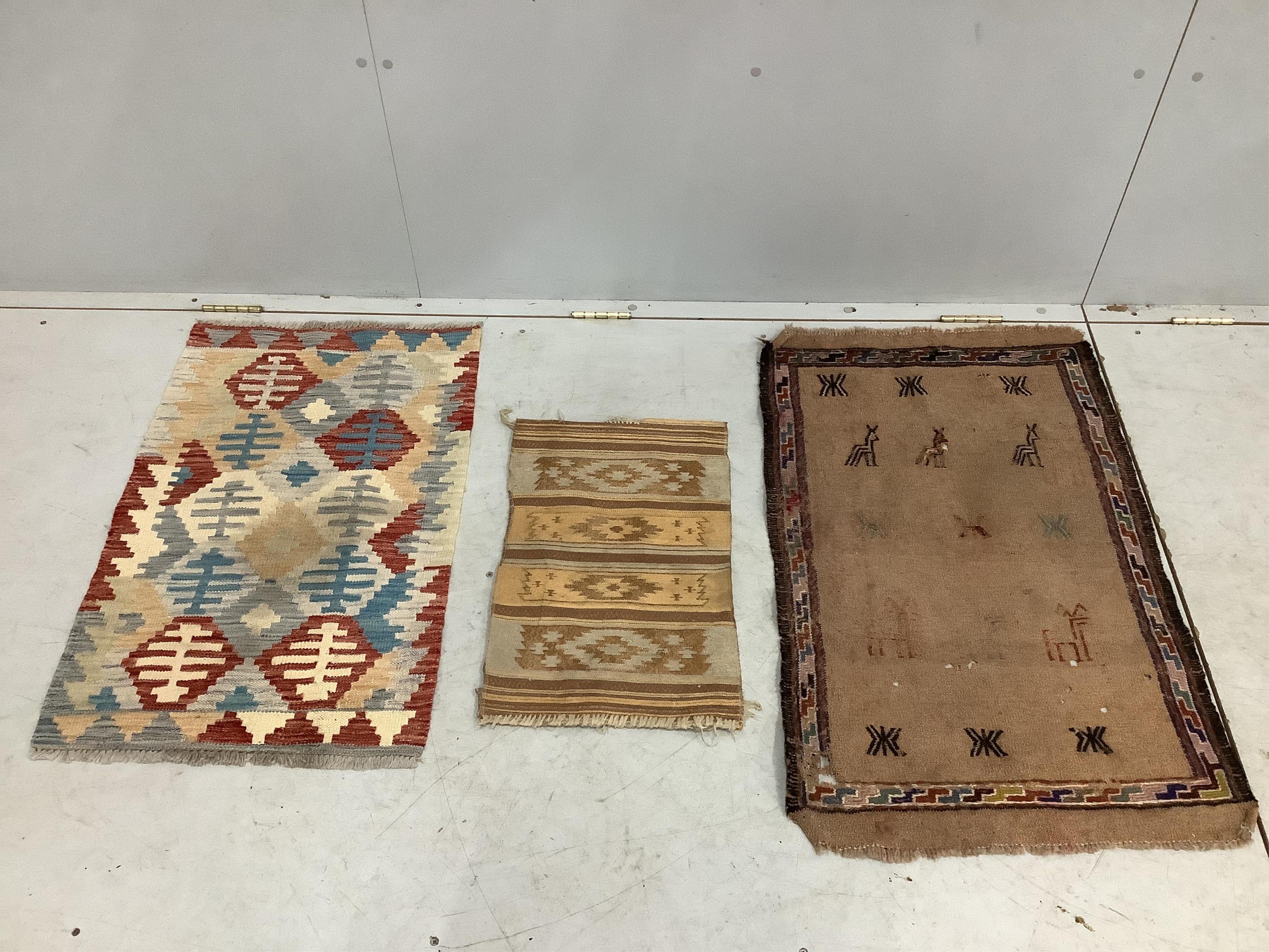 Two Kilim rugs, mat and two fragments, largest 170 x 120cm. Condition - fair